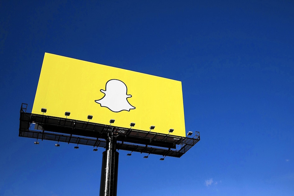 In this image Snapchat creates a billboard featuring only their logo to intrigue potential users and build hype